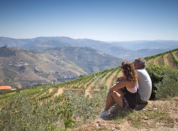 Couple admiring Douro Valley vineyards